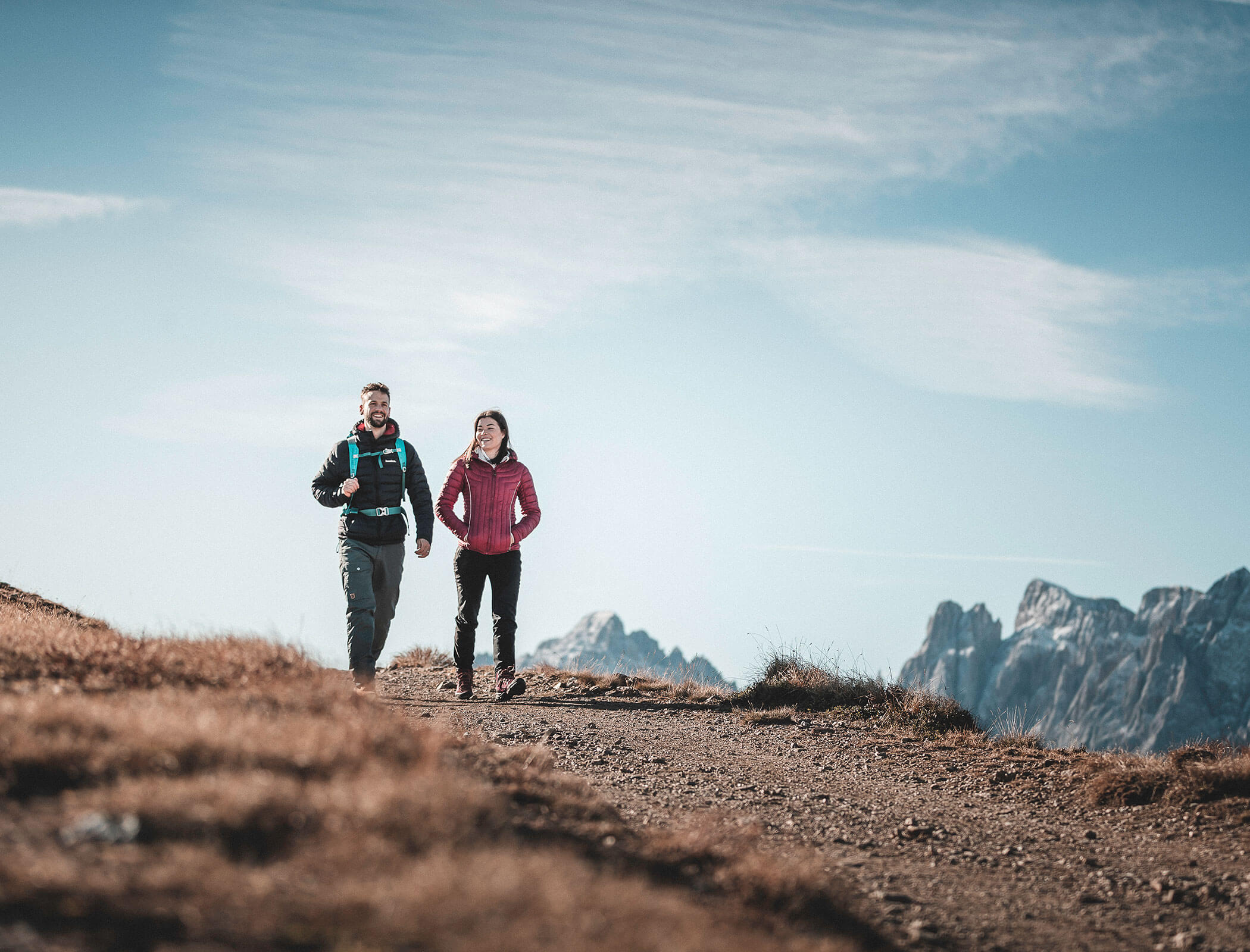 A couple hiking in the South Tyrolean mountains - Zin Park Residence